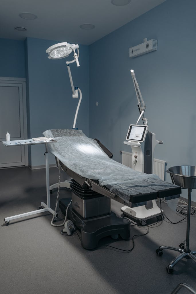 A sterile, modern operating room with surgical equipment in a healthcare facility.